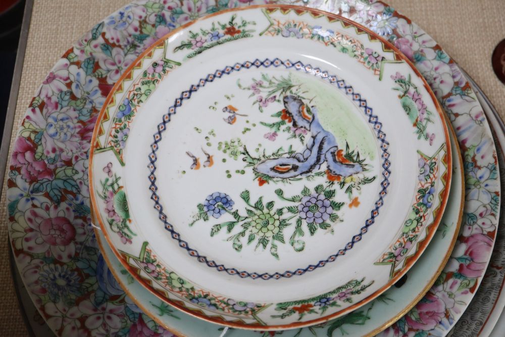 A collection of Oriental chargers and plates,